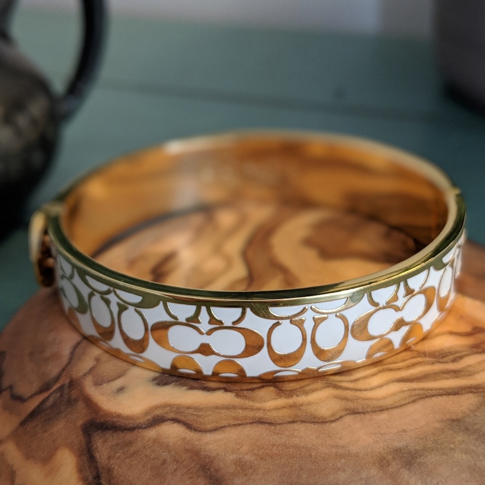 Coach gold and white color bracelet
